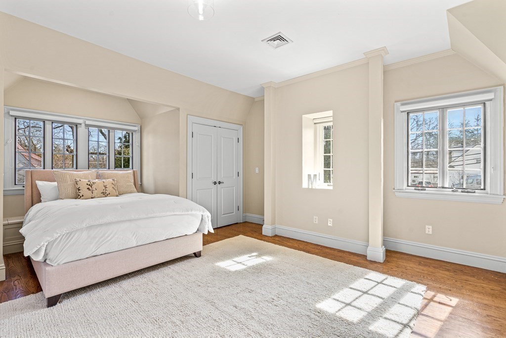 77 Cliff Road Wellesley, MA 02481 - Photo 23 of 33 a bedroom with a bed and a window