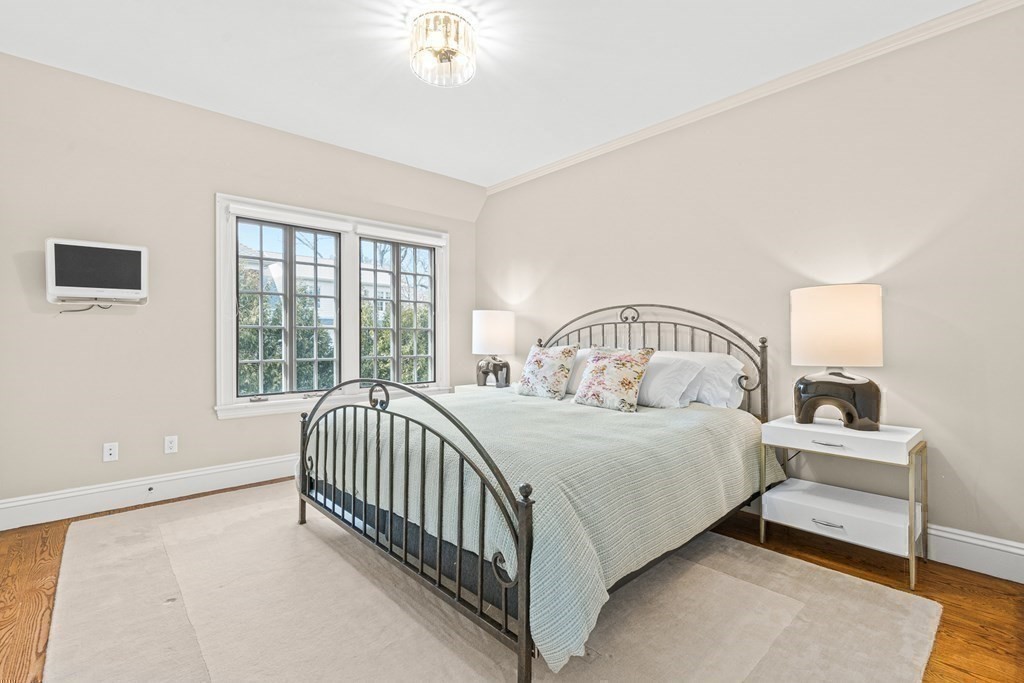 77 Cliff Road Wellesley, MA 02481 - Photo 26 of 33 a bedroom with a bed and window