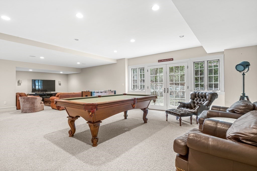 77 Cliff Road Wellesley, MA 02481 - Photo 28 of 33 a living room with furniture a table and a large window
