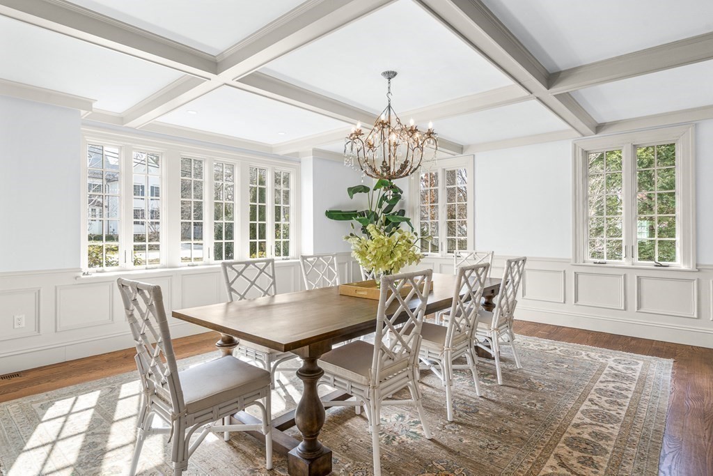 77 Cliff Road Wellesley, MA 02481 - Photo 4 of 33 a dining room with furniture a chandelier and wooden floor