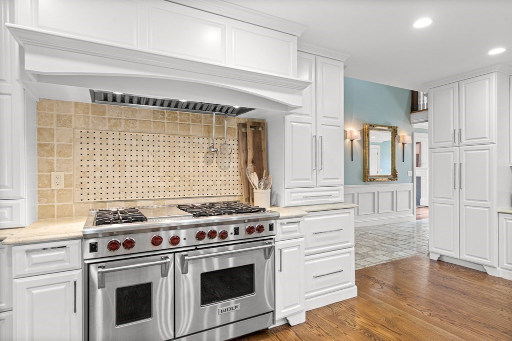 77 Cliff Road Wellesley, MA 02481 - Photo 6 of 33 a kitchen with a stove and a microwave