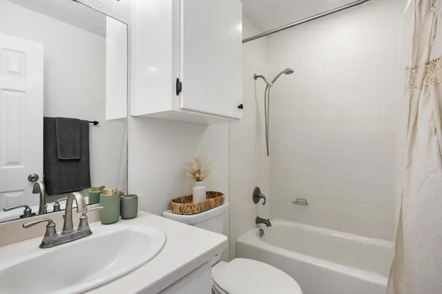 a view of a porch with furniture and a yard