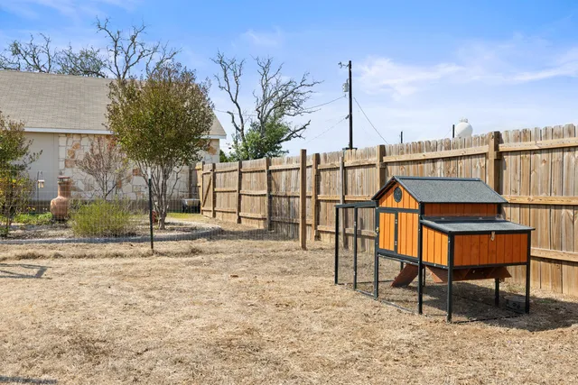 a view of a patio with wooden floor
