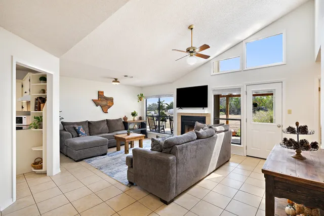 a kitchen with white cabinets and appliances