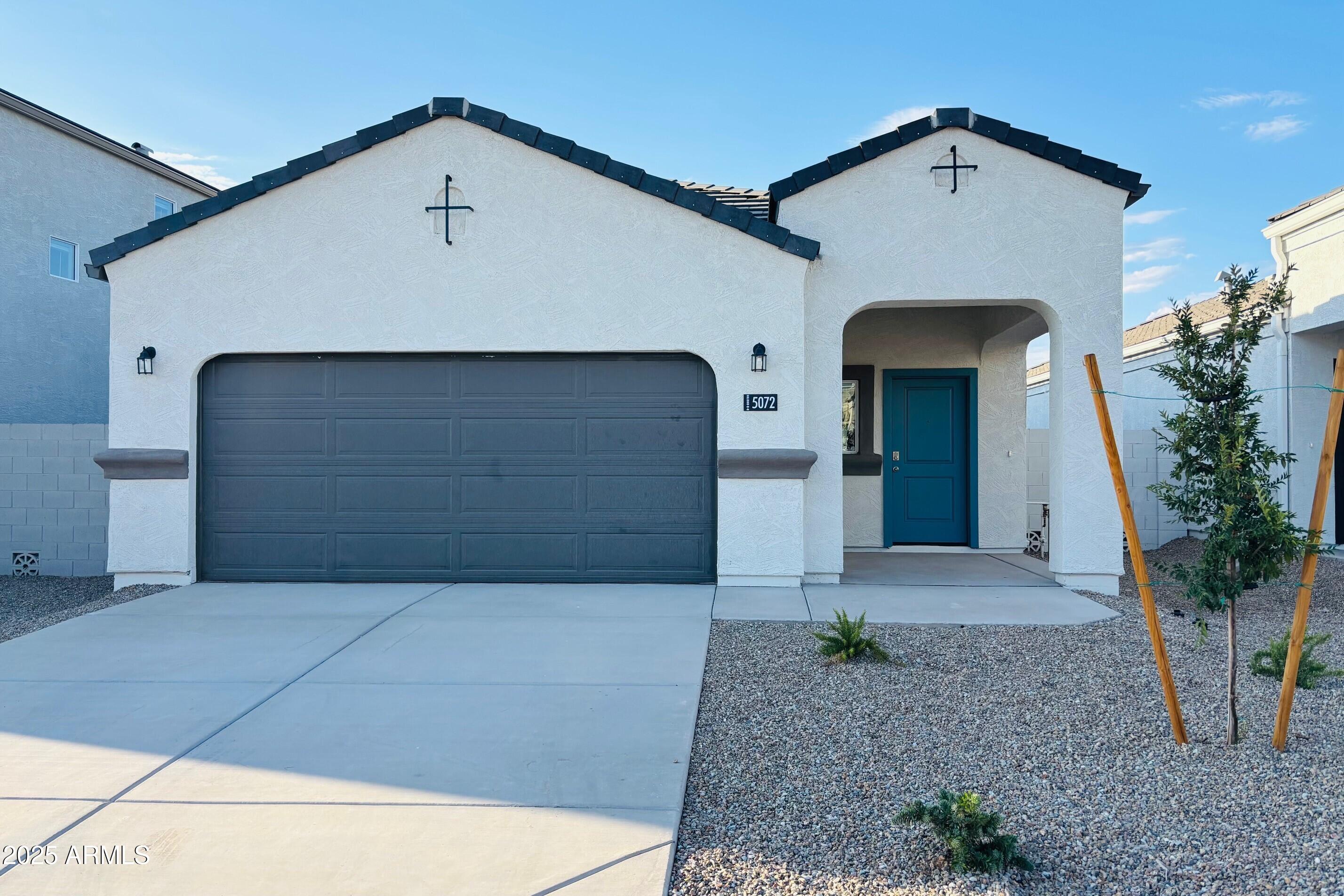 5072 East Umber Road San Tan Valley, AZ 85143 - Photo 1 of 41 a front view of a house with a yard