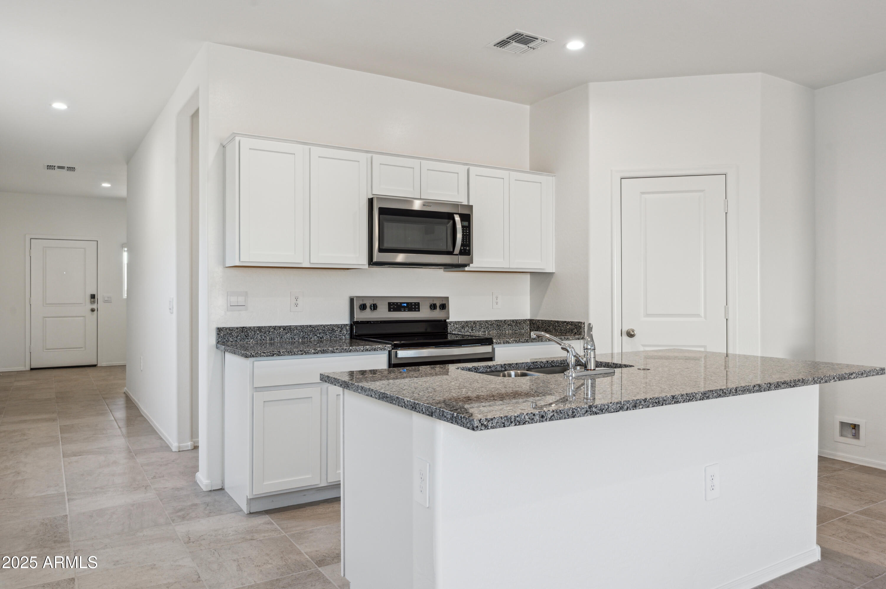 5072 East Umber Road San Tan Valley, AZ 85143 - Photo 11 of 41 a kitchen with stainless steel appliances granite countertop a sink stove and refrigerator