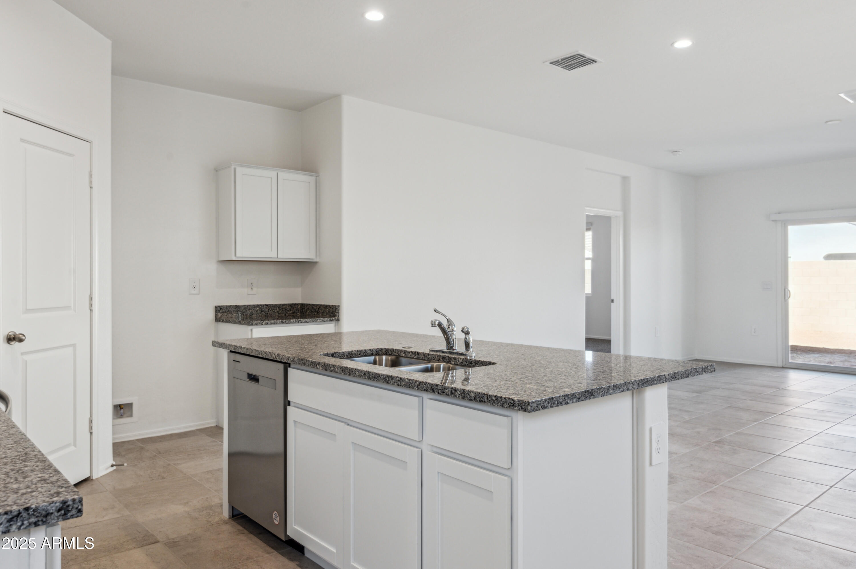 5072 East Umber Road San Tan Valley, AZ 85143 - Photo 16 of 41 a kitchen with stainless steel appliances granite countertop a sink stove and cabinets