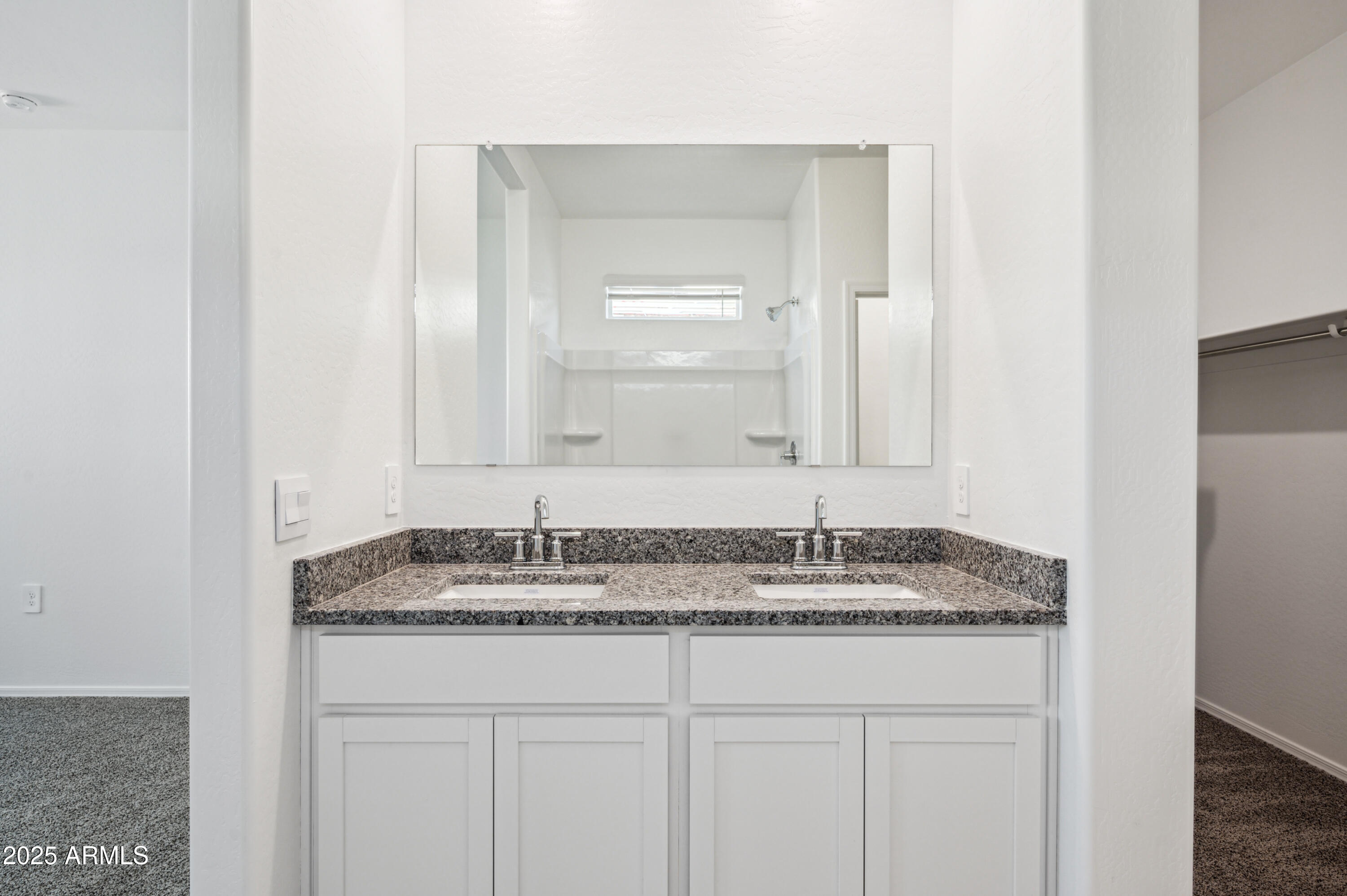 5072 East Umber Road San Tan Valley, AZ 85143 - Photo 23 of 41 a bathroom with a granite countertop sink and a mirror