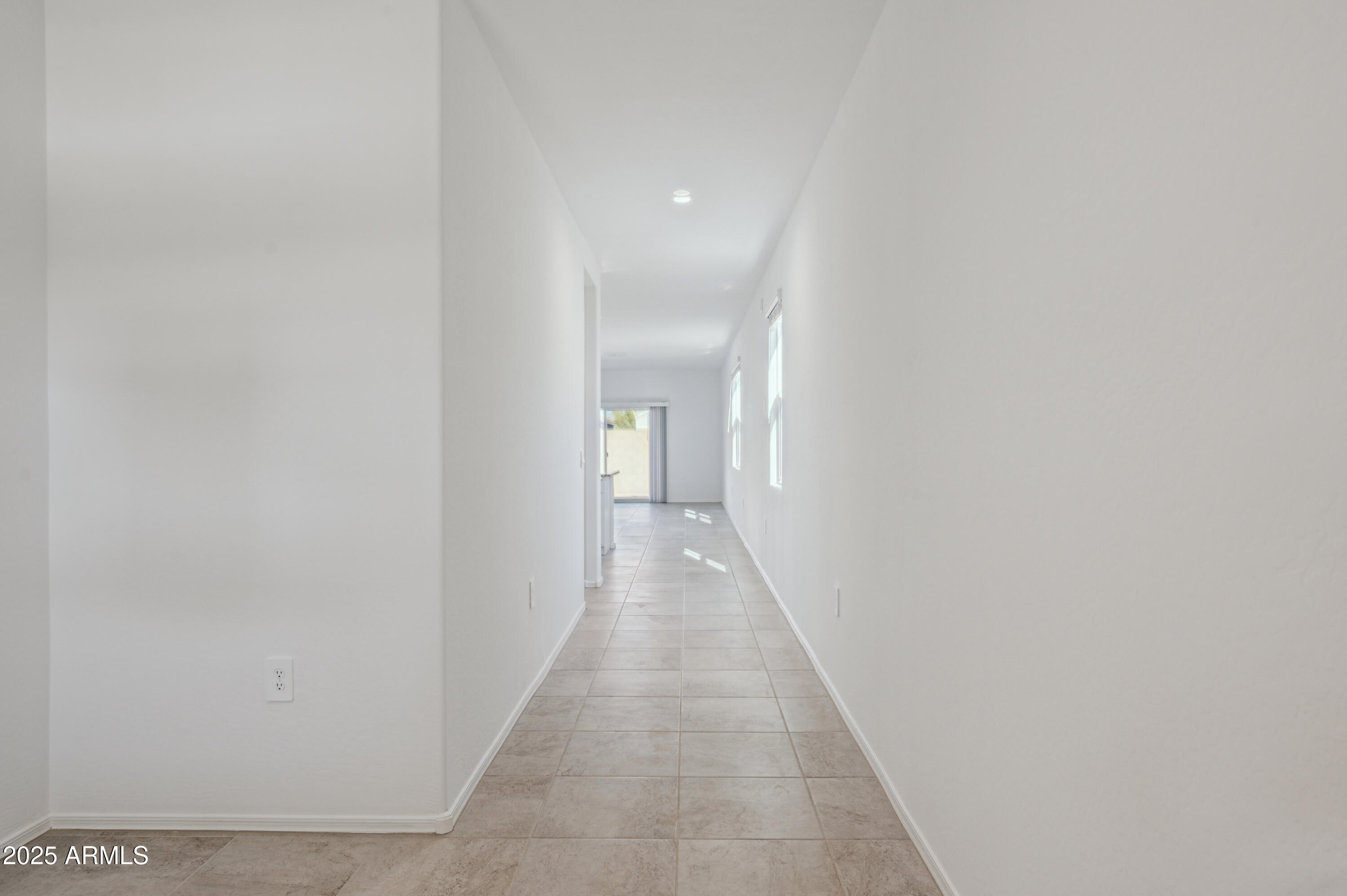 5072 East Umber Road San Tan Valley, AZ 85143 - Photo 4 of 41 a view of a hallway with wooden floor