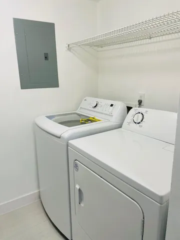 a utility room with dryer and washer