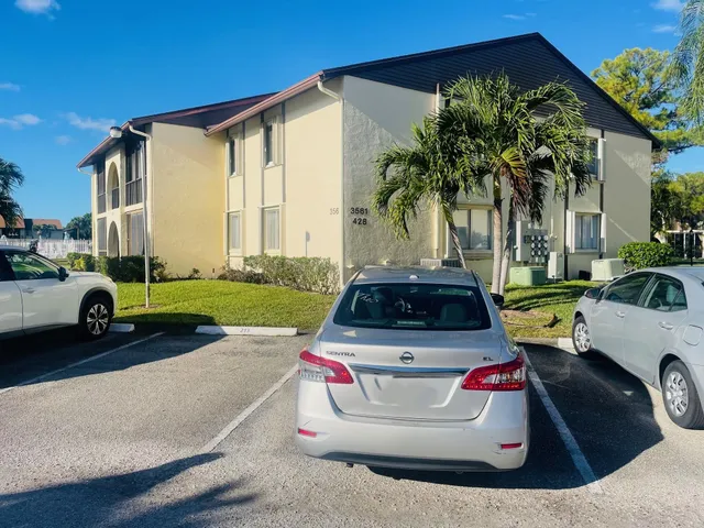 a car parked in front of a house