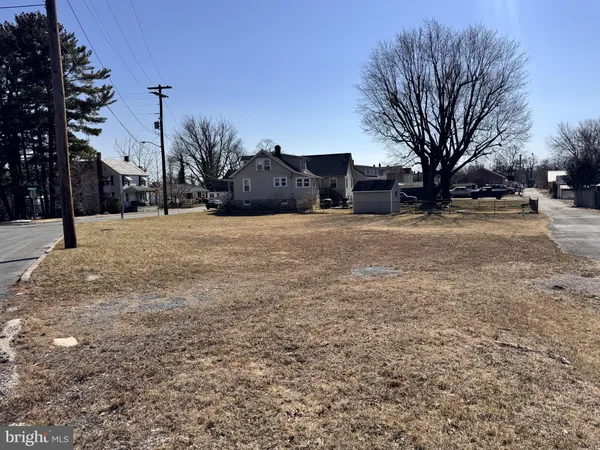 a view of a house with a snow in the yard