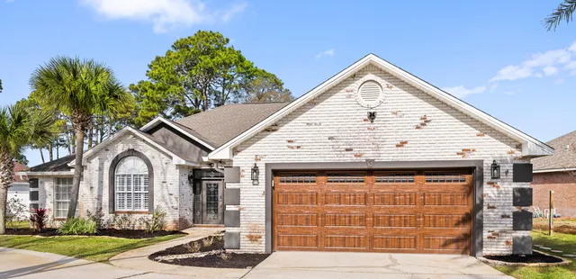 a view of a wooden house with large windows