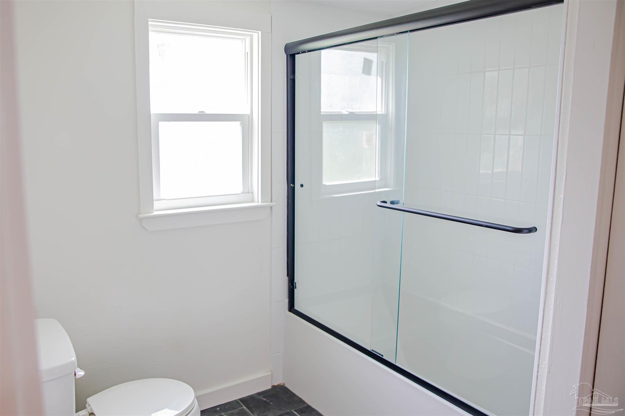 5347 Stewart Street Milton, FL 32570 - Photo 17 of 20 a bathroom with a toilet