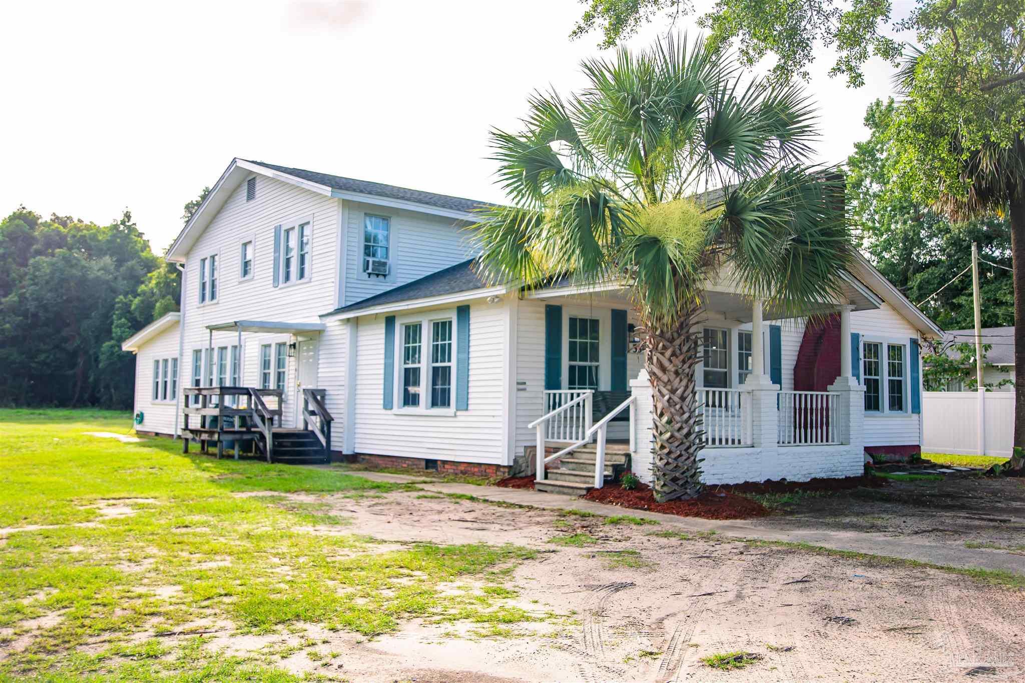5347 Stewart Street Milton, FL 32570 - Photo 20 of 20 a front view of a house with garden