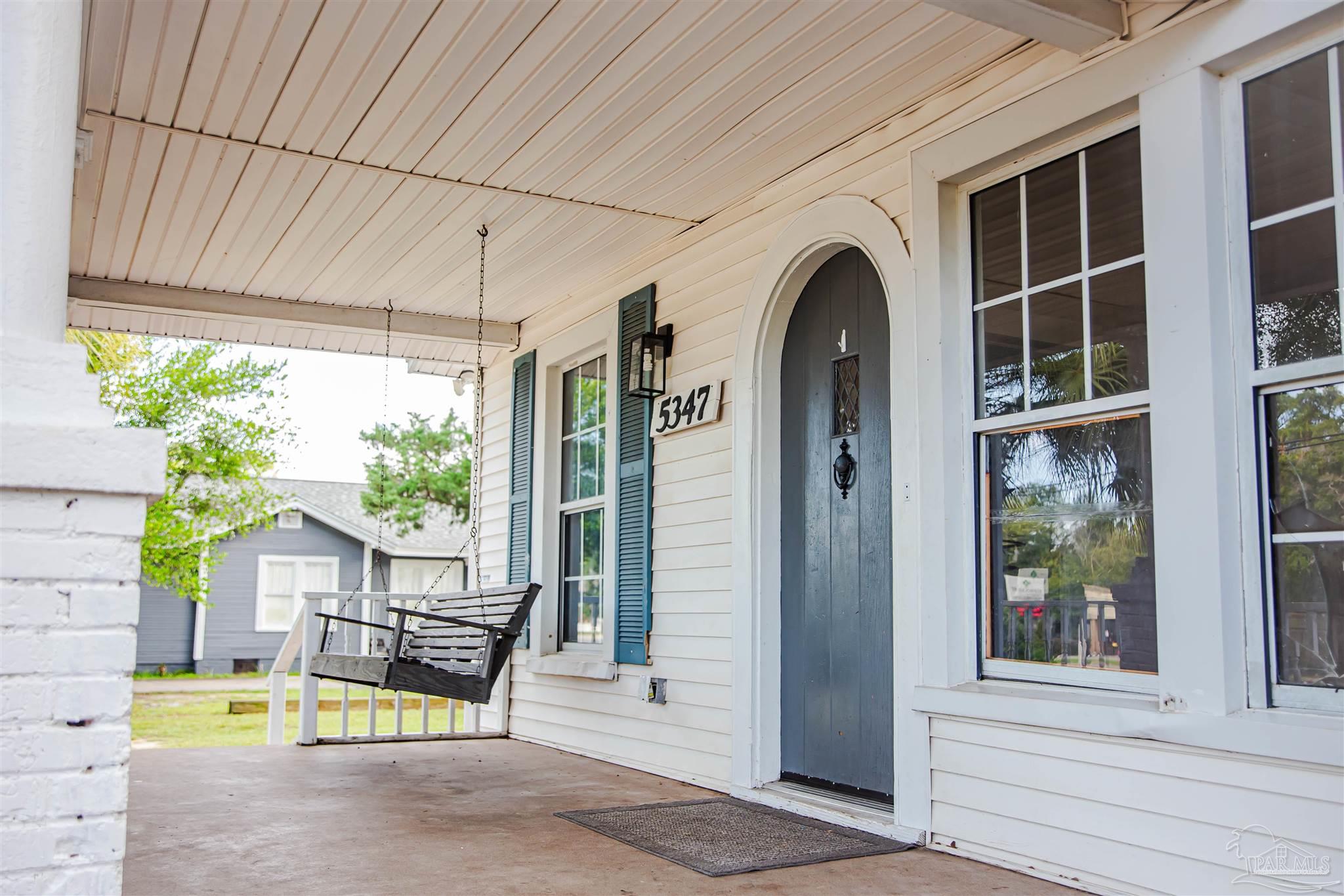 5347 Stewart Street Milton, FL 32570 - Photo 2 of 20 a view of a house with sitting area and garden
