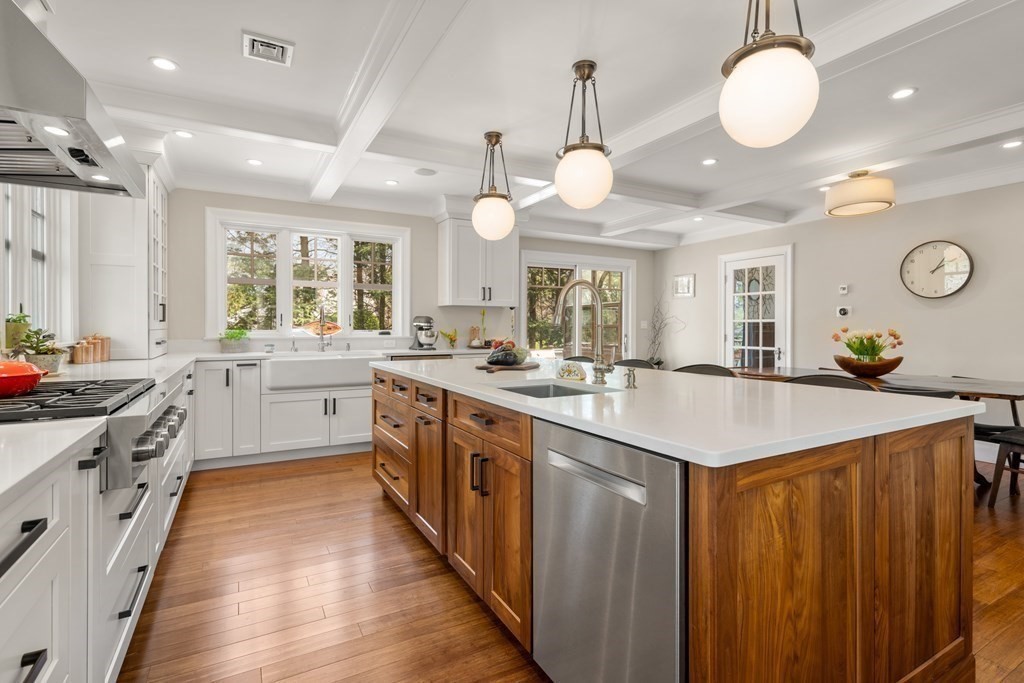 28 Sheffield Road Newton, MA 02465 - Photo 2 of 39 a large kitchen with kitchen island a large counter space a sink a window and stainless steel appliances