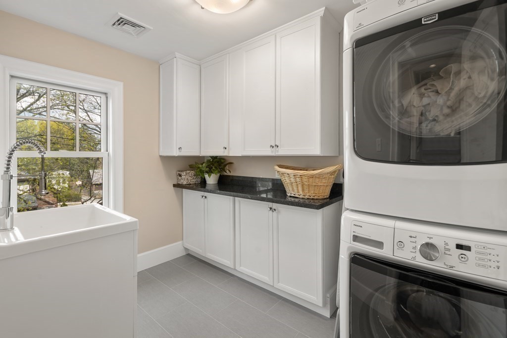 28 Sheffield Road Newton, MA 02465 - Photo 25 of 39 a kitchen with a sink and a stove top oven