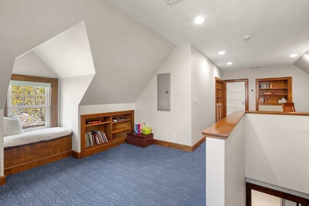 28 Sheffield Road Newton, MA 02465 - Photo 26 of 39 a living room with furniture and a flat screen tv