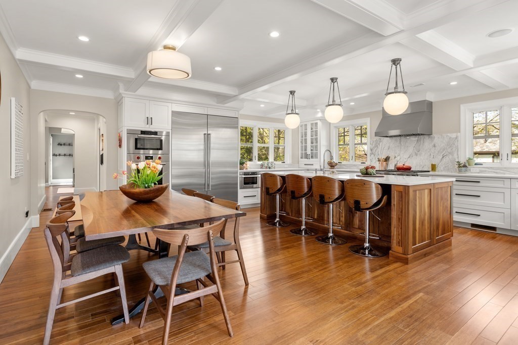 28 Sheffield Road Newton, MA 02465 - Photo 4 of 39 a view of a dining room and livingroom with furniture wooden floor a chandelier