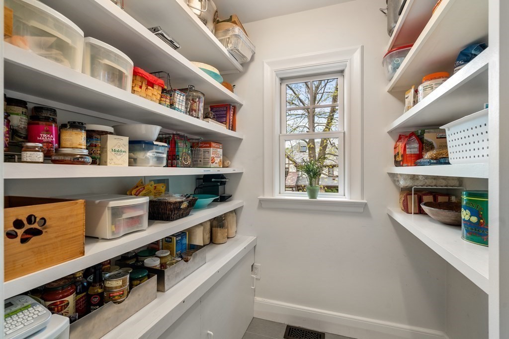 28 Sheffield Road Newton, MA 02465 - Photo 9 of 39 a room with lots of books and a window