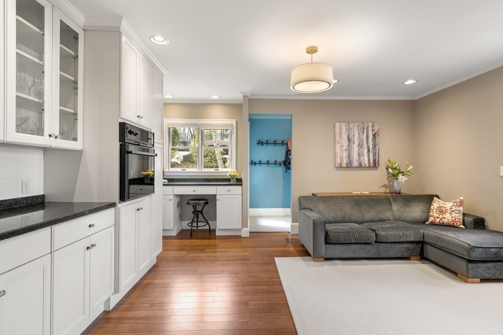 28 Sheffield Road Newton, MA 02465 - Photo 10 of 39 a living room with furniture a fireplace and a flat screen tv