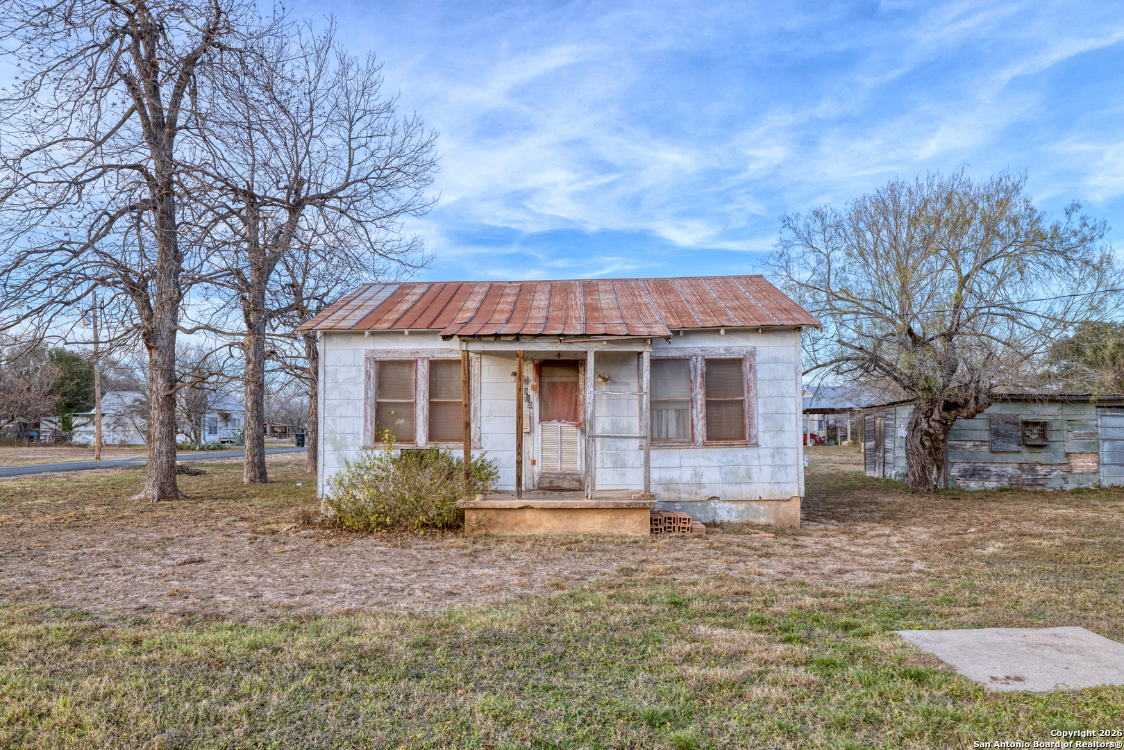 910 15th Street Hondo, TX 78861 - Photo 24 of 26 a front view of a house with a yard