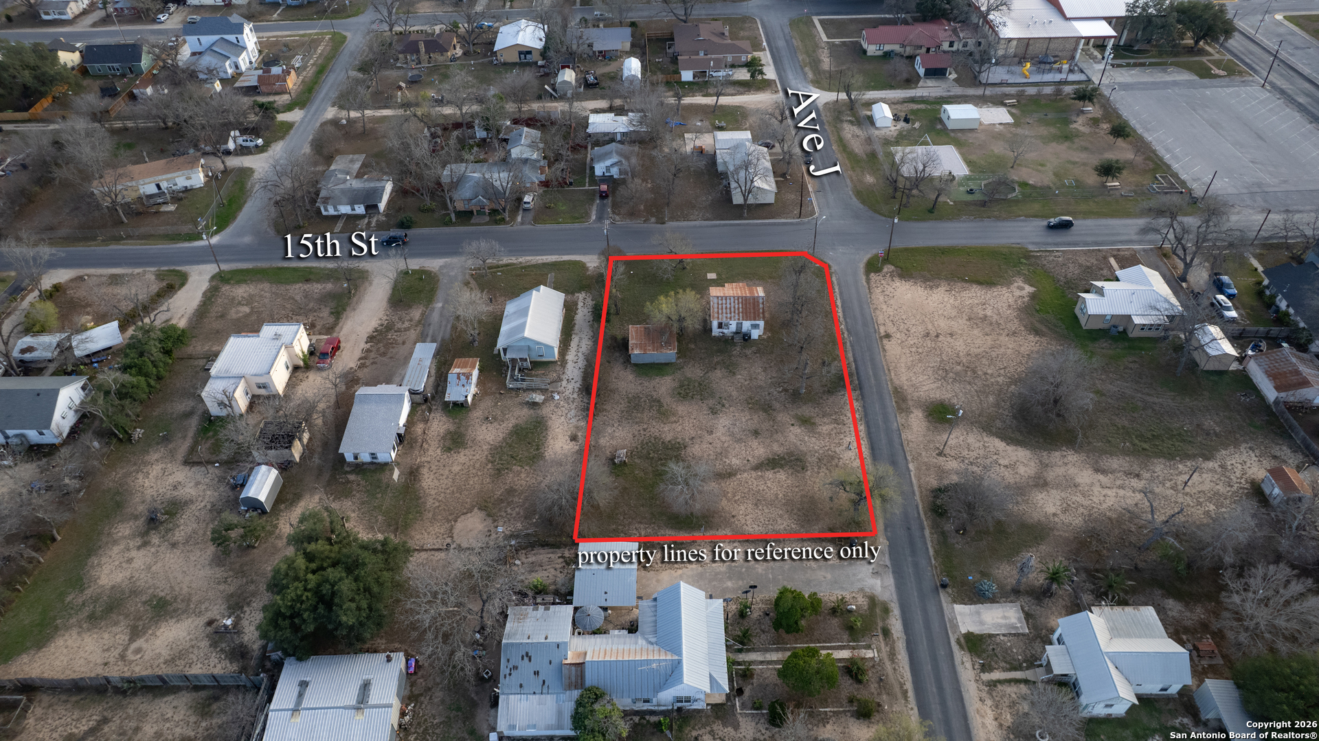 910 15th Street Hondo, TX 78861 - Photo 7 of 26 an aerial view of a house with a yard