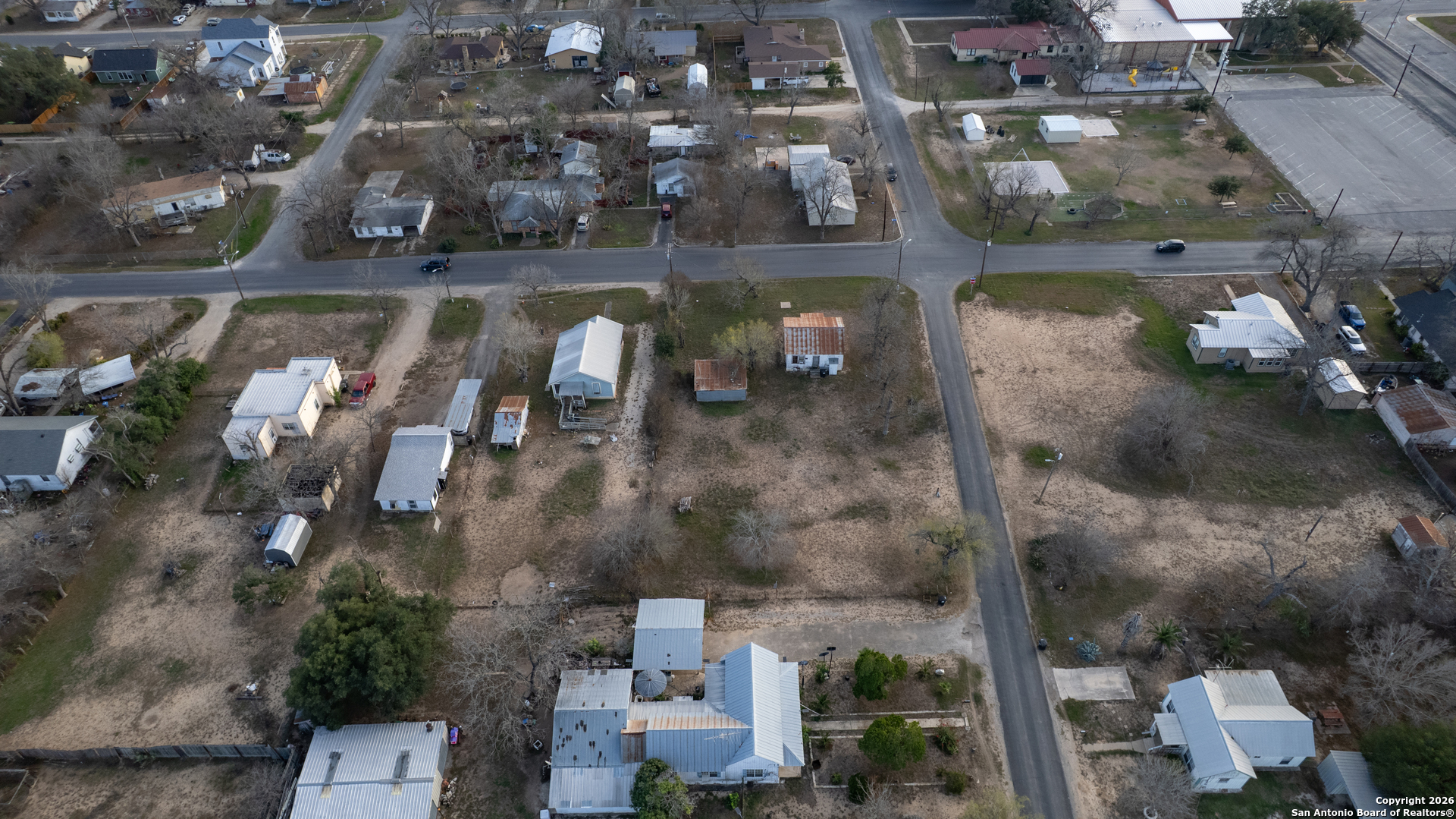 910 15th Street Hondo, TX 78861 - Photo 8 of 26 an aerial view of a house with a lake