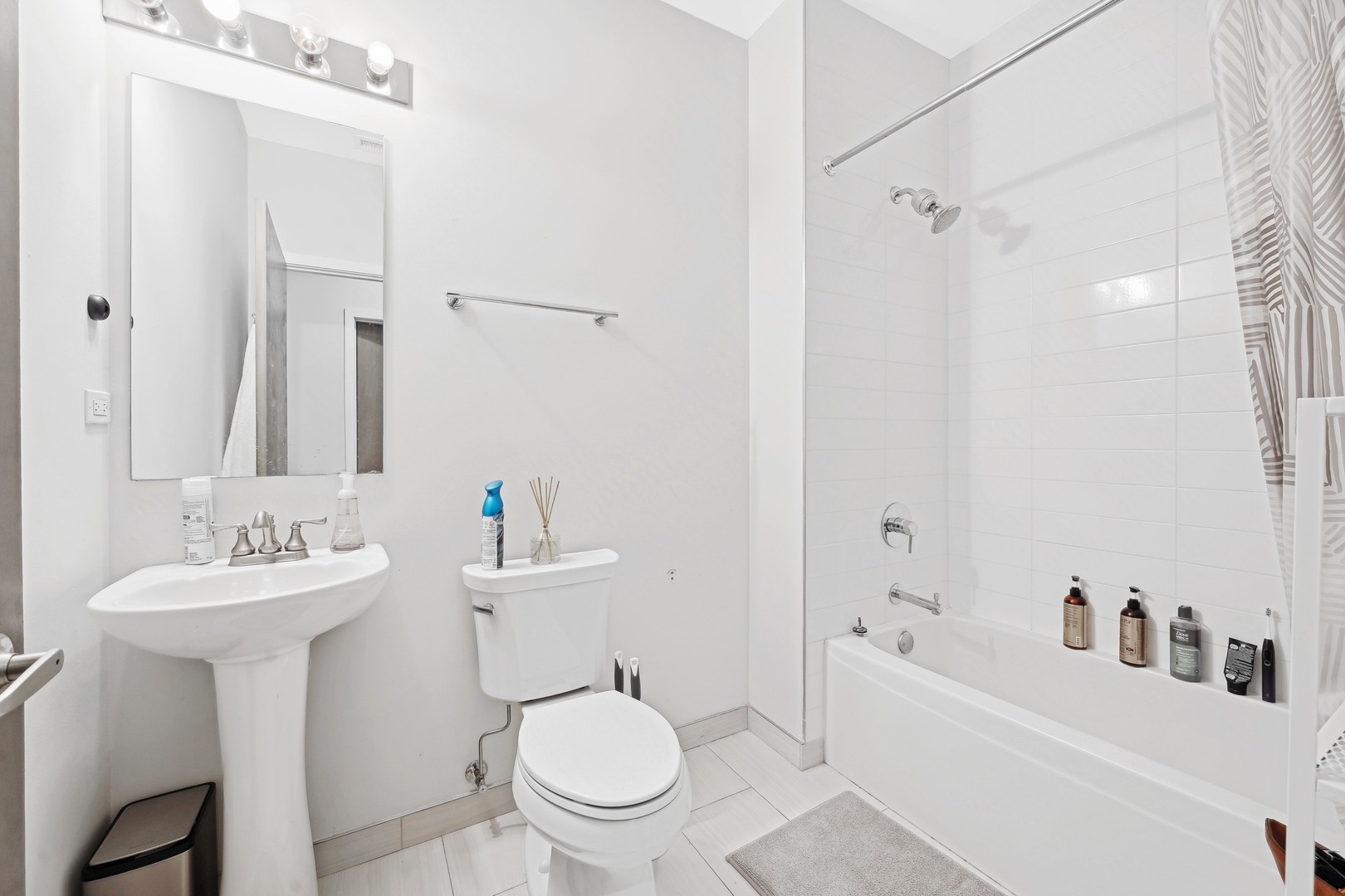 4027 North Broadway Chicago, IL 60613 - Photo 22 of 25 a bathroom with a sink toilet and shower