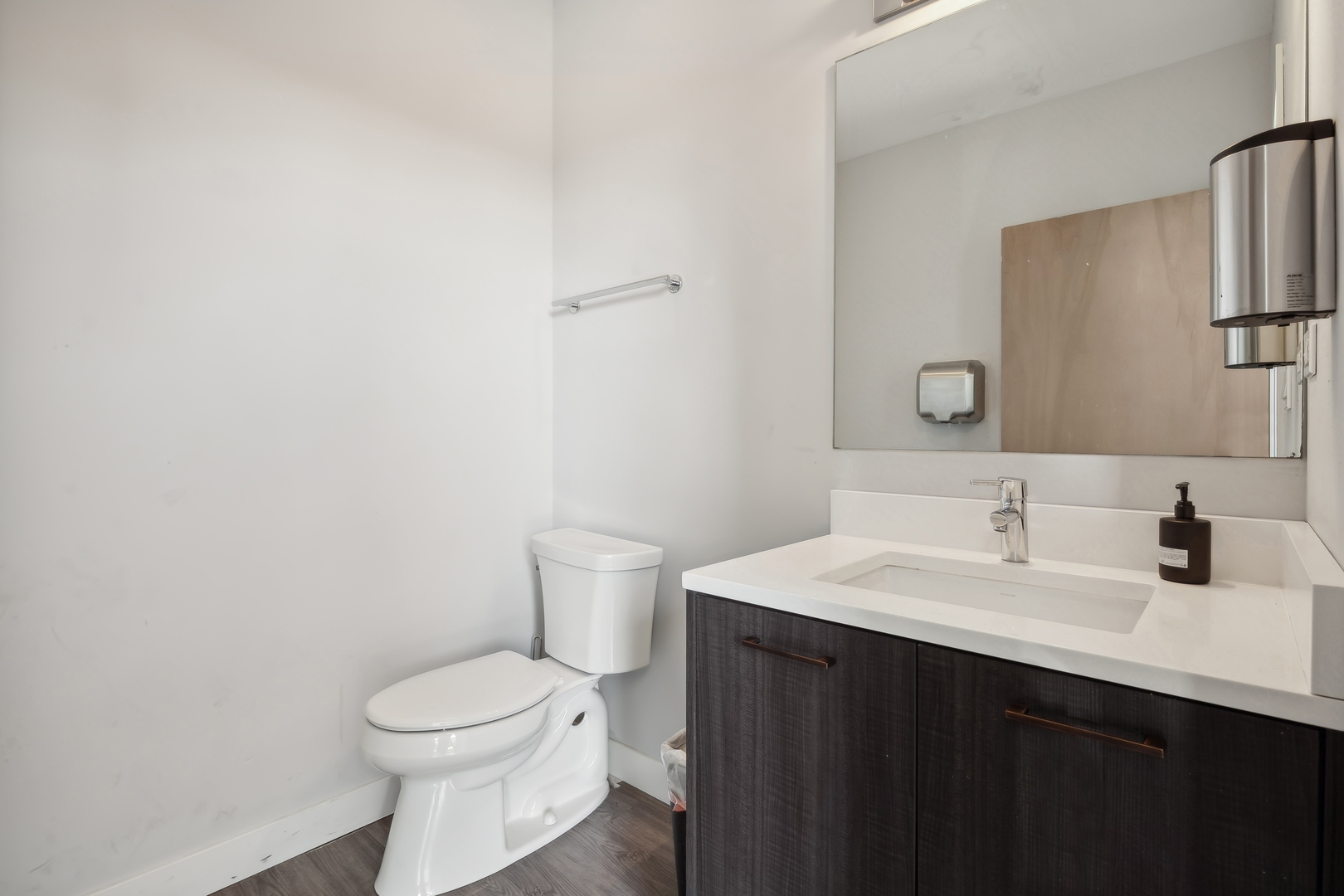4027 North Broadway Chicago, IL 60613 - Photo 6 of 25 a bathroom with a sink and a toilet