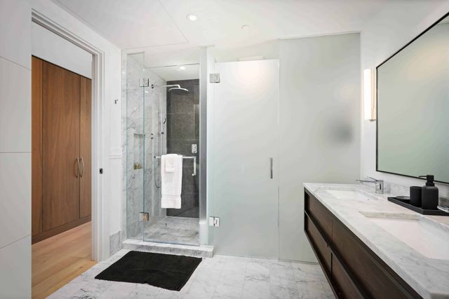 a bathroom with a sink and a shower