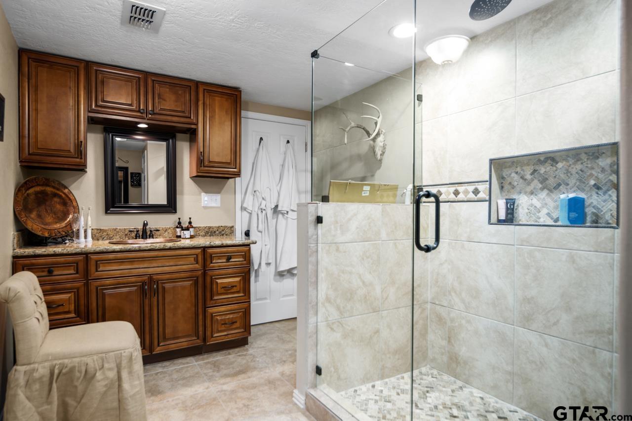 751 Houston Street Lovelady, TX 75851 - Photo 16 of 25 a bathroom with a sink a toilet and shower