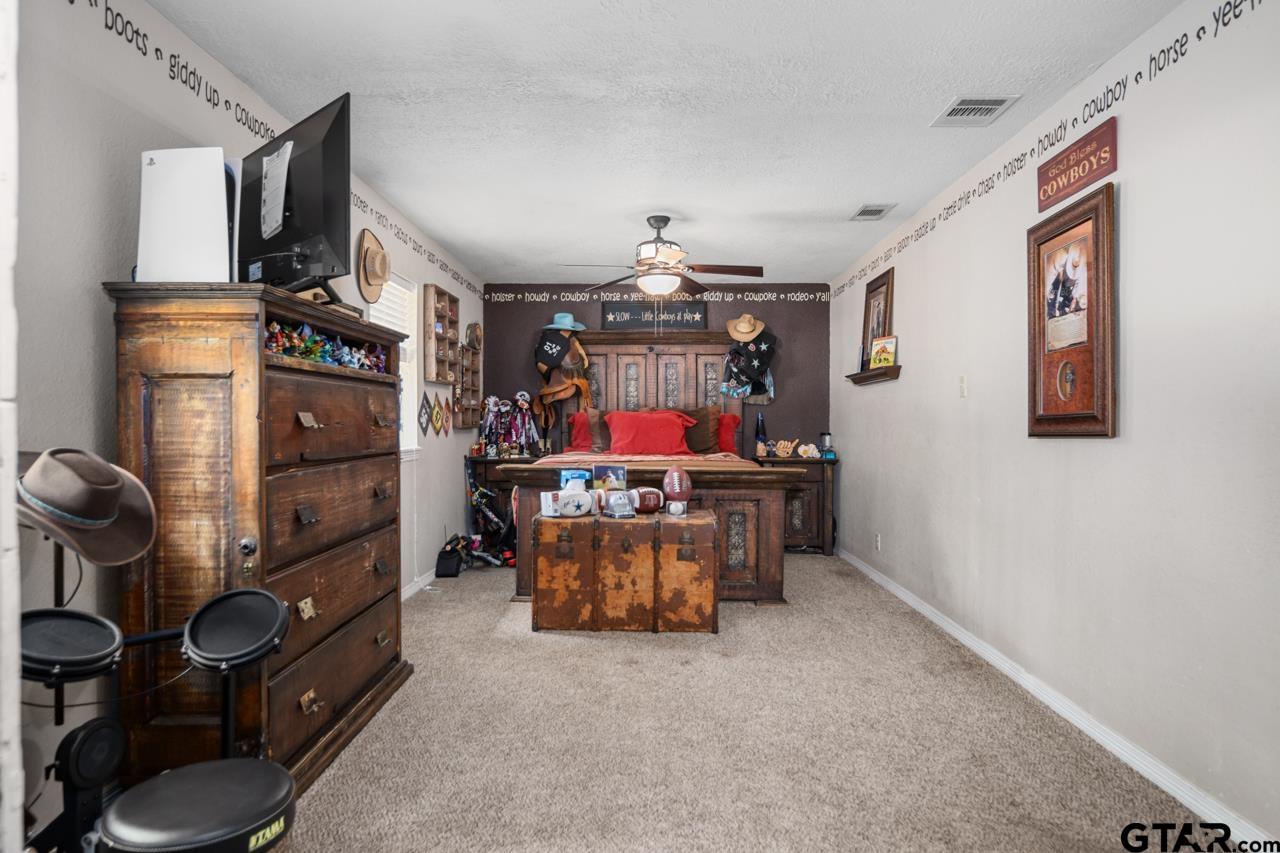 751 Houston Street Lovelady, TX 75851 - Photo 17 of 25 a living room with furniture and a flat screen tv