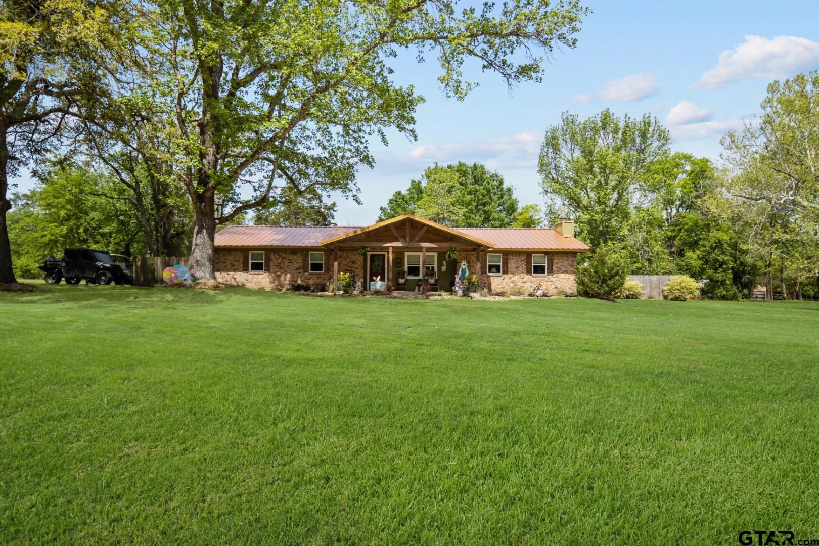 751 Houston Street Lovelady, TX 75851 - Photo 2 of 25 a front view of house with yard and green space
