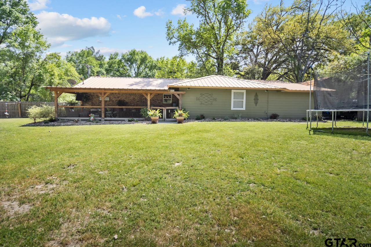 751 Houston Street Lovelady, TX 75851 - Photo 21 of 25 a view of a house with a yard and sitting area