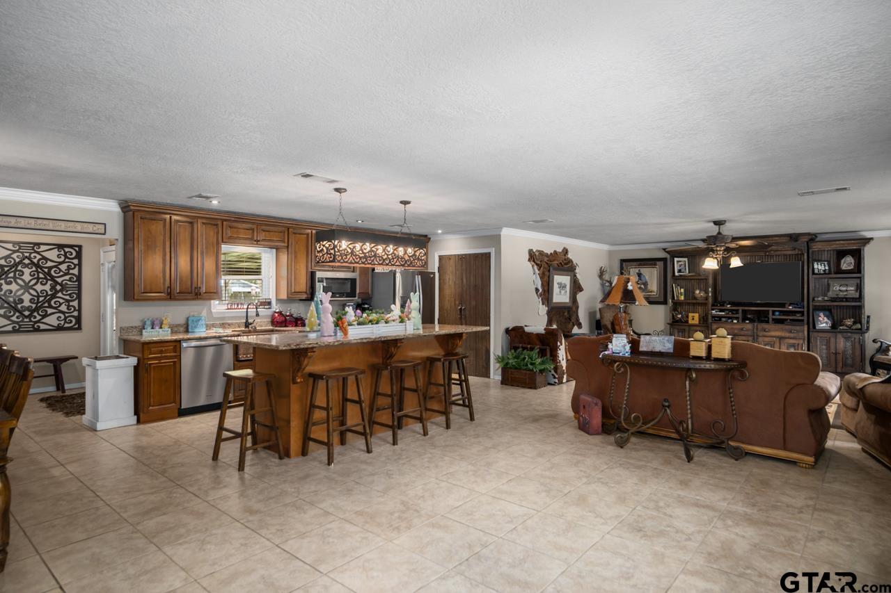 751 Houston Street Lovelady, TX 75851 - Photo 6 of 25 a view of a dining room with furniture and chandelier