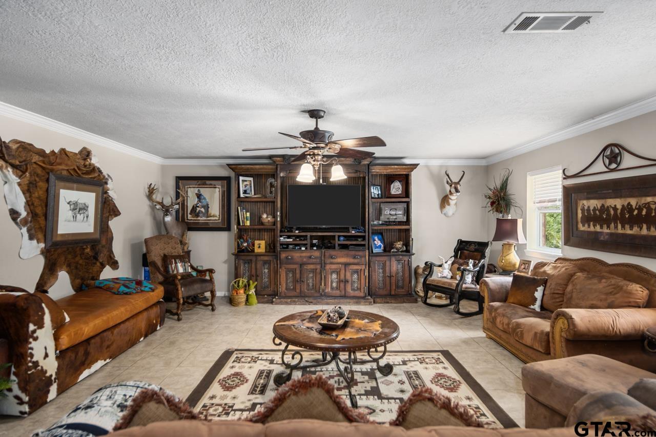 751 Houston Street Lovelady, TX 75851 - Photo 7 of 25 a living room with furniture and a flat screen tv
