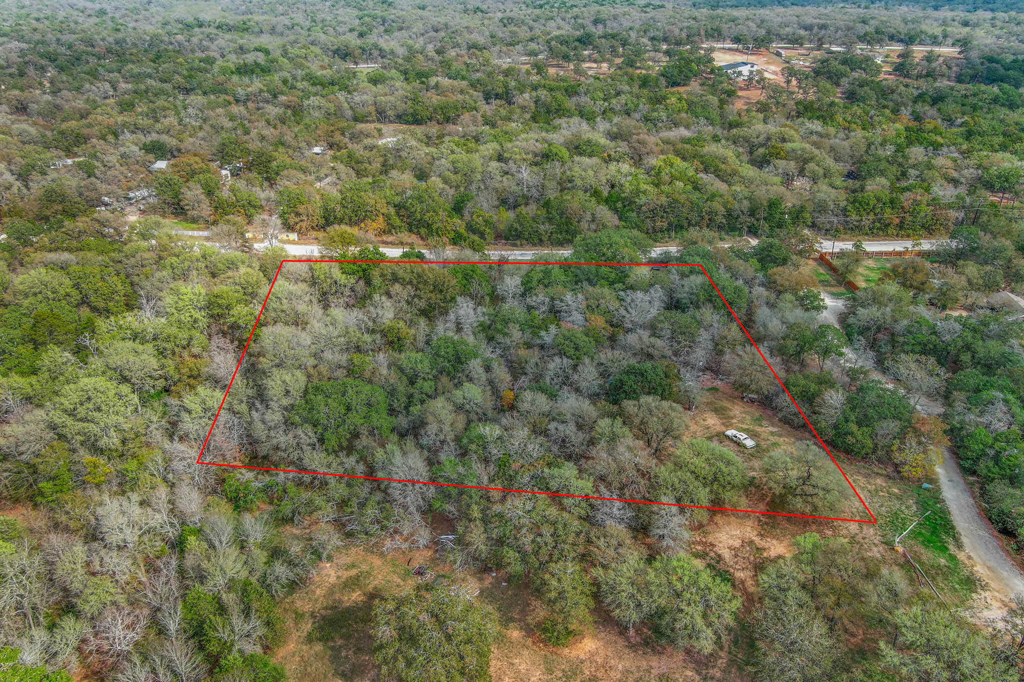 235 The Forest Road Dale, TX 78616 - Photo 2 of 14 Aerial view of property and surrounding area featuring property parcel outlined
