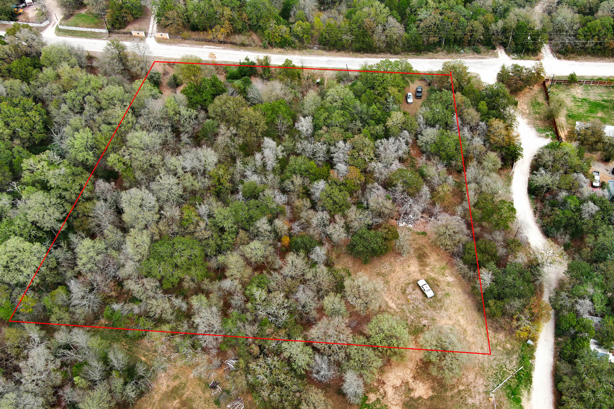 235 The Forest Road Dale, TX 78616 - Photo 4 of 14 Aerial overview of property's location with property boundaries highlighted