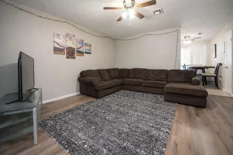 a black leather couch in a room