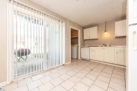 a view of kitchen with furniture and wooden floor