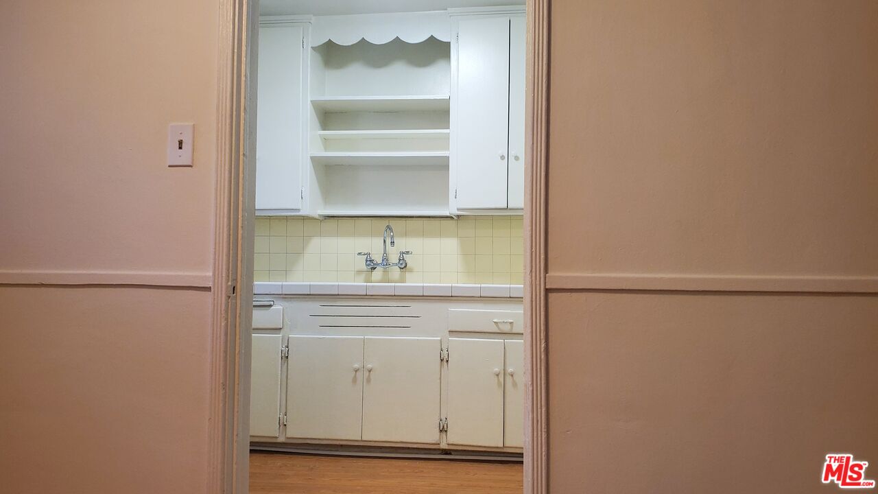 11202 Camarillo Street, Unit 11204 North Hollywood, CA 91602 - Photo 6 of 9 a bathroom with a sink and a mirror