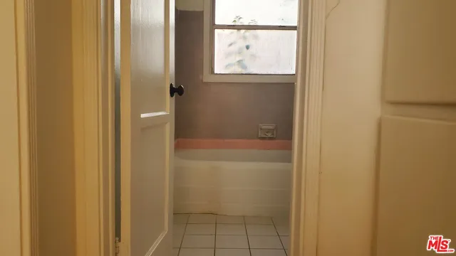 a bathroom with a glass shower door
