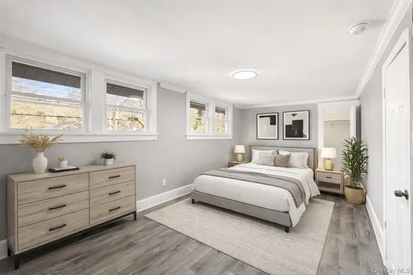 a bedroom with a large bed and a dresser