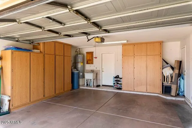 a view of a room with wooden floor and furniture