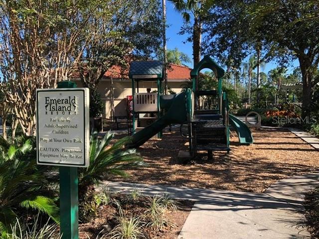 8521 Crystal Cove Loop Kissimmee, FL 34747 - Photo 13 of 23 a sign on the side of a road