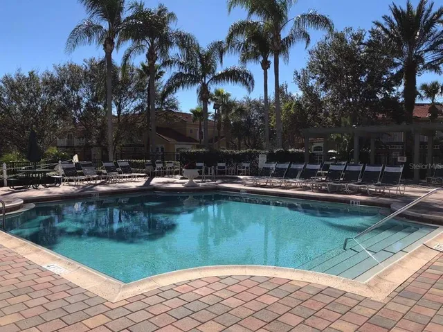 a view of a swimming pool with a patio