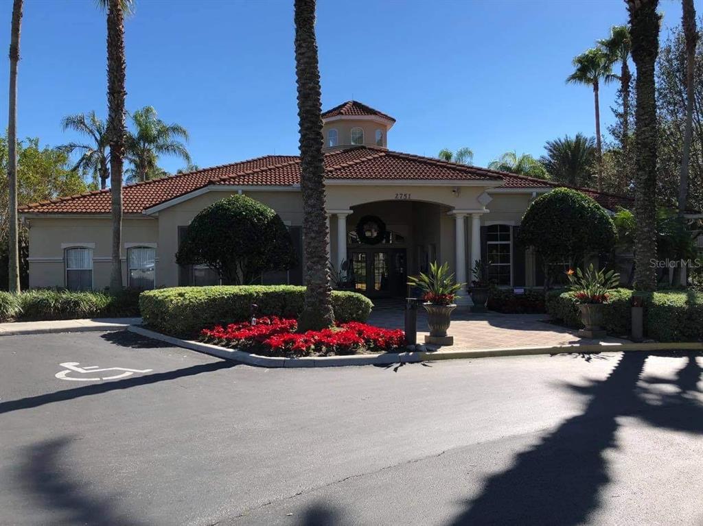8521 Crystal Cove Loop Kissimmee, FL 34747 - Photo 19 of 23 a view of a house with potted plants next to a road