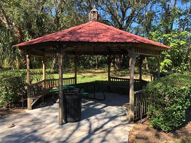 8521 Crystal Cove Loop Kissimmee, FL 34747 - Photo 22 of 23 a patio with table and chairs